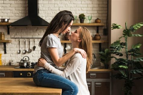 2 lesbians kissing|Authentic LGBT female lesbian couple kissing each other in slow。